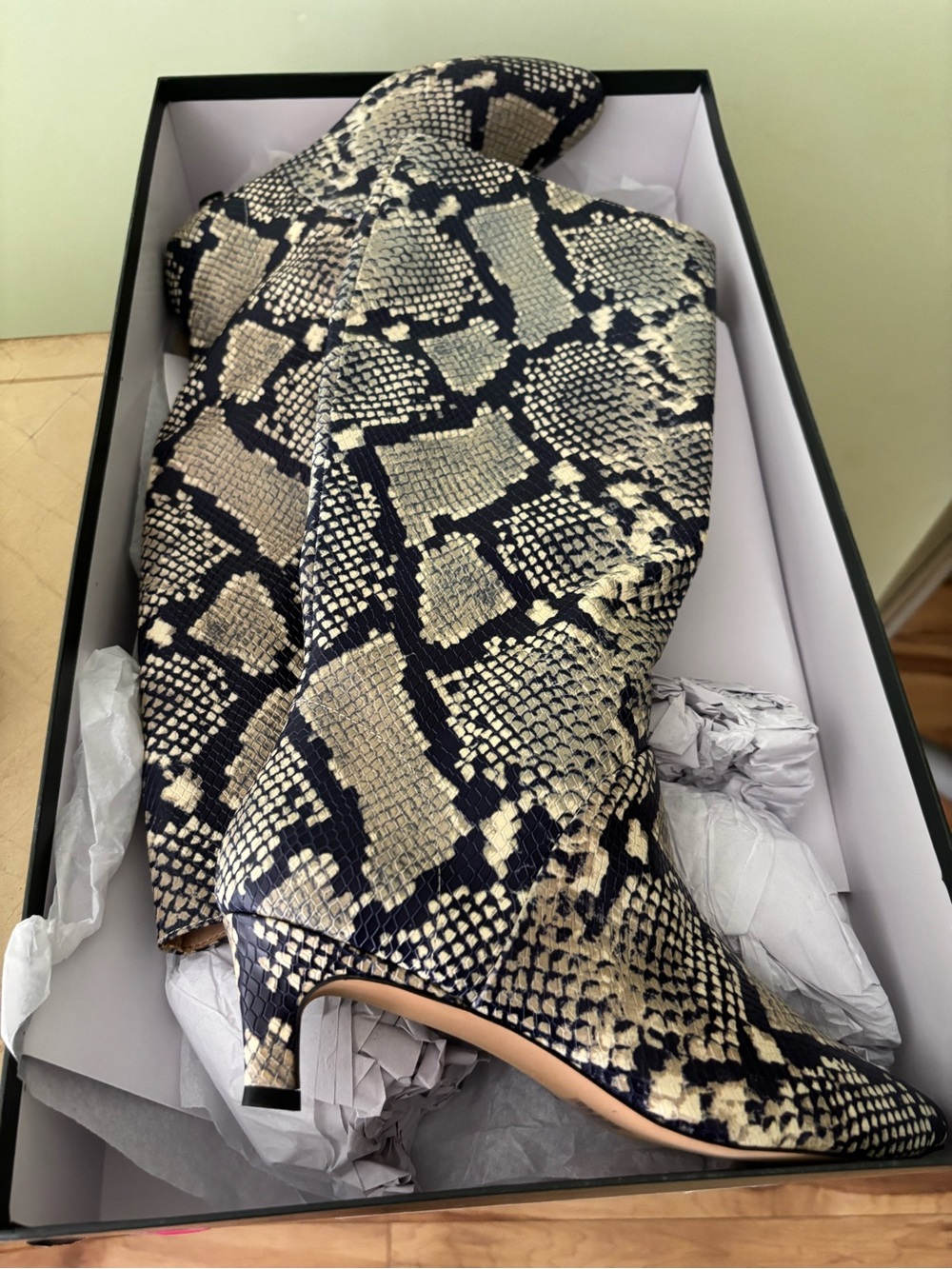 Snake print leather boots